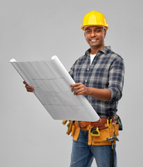 profession, construction and building - happy smiling indian builder in helmet with blueprint over grey background