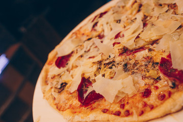 Close-Up Pepperoni Pizza bacon barbeque pizza cheese, salami, Tomatoes, pepper, Spices and Fresh Basil. Italian pizza at restaurant  Eating and leisure concept.lifestyle Organic Gourmet Concept banner