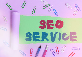 Writing note showing Seo Service. Business concept for techniques and procedures to increase the website visibility