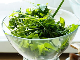 fresh salad greens in a clear Cup