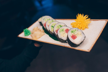 Large set of Sushi Rolls Warm Ebi Sake Unagi Spring. A lot assortment Philadelphia roll Dishes from Japanese raw fish  in one plate in traditional restaurant. Japan food menu service
