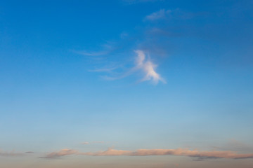 beautiful colored sunset clouds in the blue sky background
