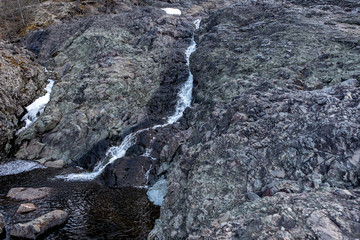 Water flows into the old crater of an extinct prehistoric volcano
