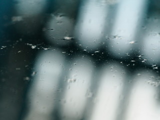 the reflection of the Windows in the gray dirty water