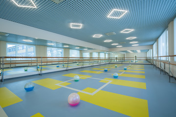 gymnastics hall, gymnasium for training with mirrors, a place for ballet, for stretching, for training, for group training, a bright spacious large hall - obrazy, fototapety, plakaty