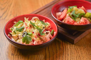 Vegetable salad with tomatoes, pepper, cucumbers, cabbage and mushrooms. Fresh organic veggies. Vegan, vegetarian diet.