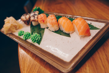 Large set of Sushi Rolls Warm Ebi Sake Unagi Spring. A lot assortment Philadelphia roll Dishes from Japanese raw fish  in one plate in traditional restaurant. Japan food menu service