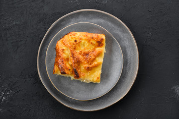 Top view of cheese puff pie from unleavened dough