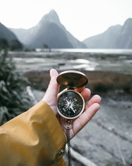 compass at milford sound, new zealand - obrazy, fototapety, plakaty