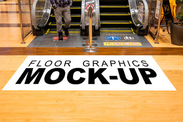 Mock up blank screen for graphic on floor near escalator