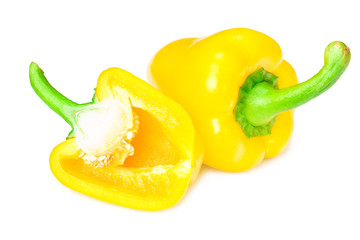 yellow sweet bell peppers with slices isolated on white background