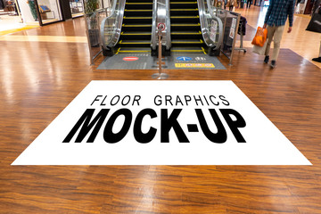 Mock up blank screen for graphic on floor near escalator