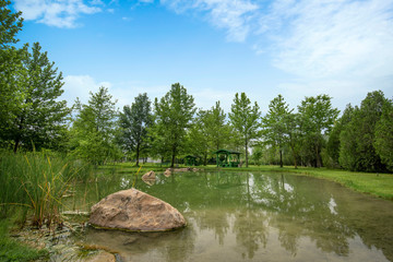 Fototapeta na wymiar The park with thermal springs at Baba Vanga at Rupite, Petrich, Bulgaria in summer time