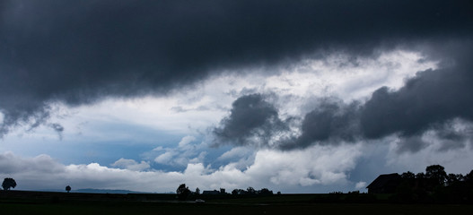 dark clouds blue sky silhouette