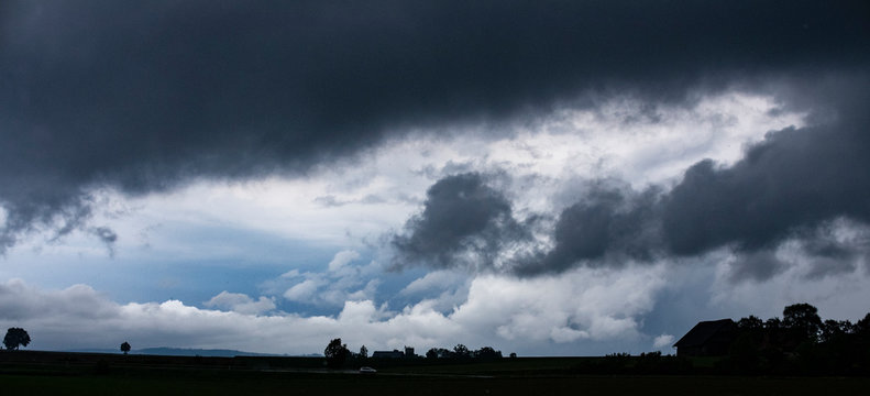 dark clouds blue sky silhouette © Harald