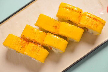 Sushi rolls philadelphia or california with cheddar and creame cheese, with tuna and avocado.