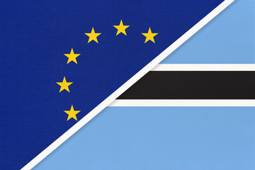 European Union or EU and Botswana national flag from textile. Symbol of the Council of Europe association.