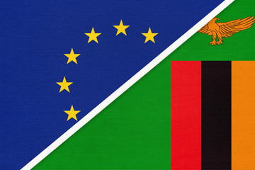 European Union or EU and Zambia national flag from textile. Symbol of the Council of Europe association.