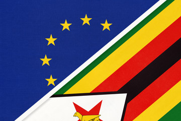 European Union or EU and Zimbabwe national flag from textile. Symbol of the Council of Europe association.
