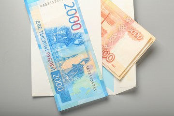 Cash notes in a white postal envelope. Russian money in a postal envelope. Bills in an envelope.