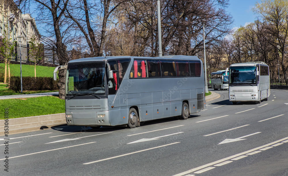 Canvas Prints Tour Buses Move On City Street