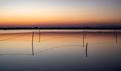A series of landscapes of a salt lake in a seaside resort after sunset. Magic colors. Contemplation.