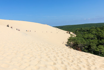 People walking on the top of the Dune of Pilat, the tallest sand dune in Europe. La Teste-de-Buch, Arcachon Bay, Aquitaine, France