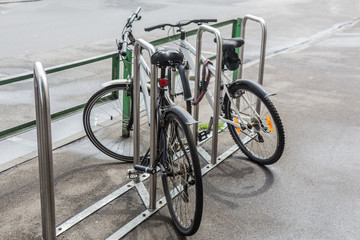 Fototapeta na wymiar Bicycles in the parking lot on the sidewalk