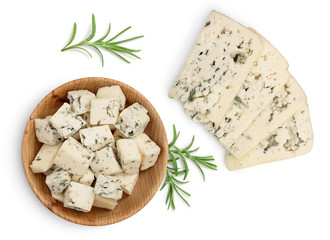 diced Blue cheese in wooden bowl isolated on white background with clipping path and full depth of field. Top view. Flat lay.