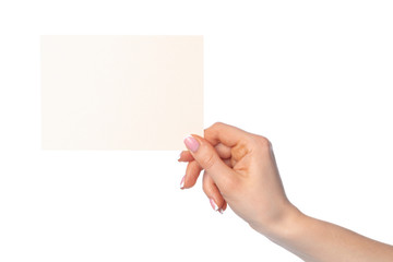 Obraz premium Woman's hand holding blank white sheet of paper isolated on white