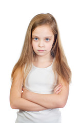 Young cute displeased girl with grey blue eyes, long light brown hair and crossed arms isolated on white background - 353064142