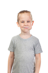 Young smiling caucasian boy with lollipop in mouth isolated on white background - 353064357