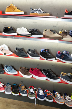 Barcelona, Spain - October 07, 2019: Shelves with sport shoes in the shoes shop