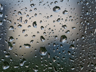 Drops of rain water on a window pane