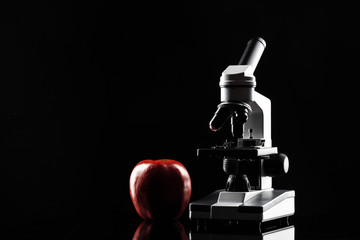 laboratory microscope on table in the dark