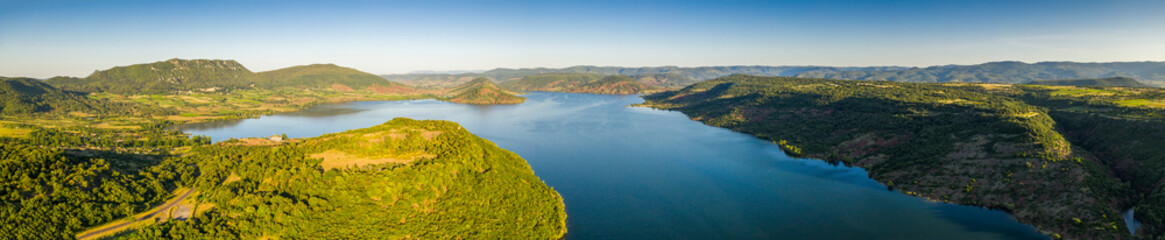 Fototapeta na wymiar Aerial panorama of Lac du Salagou in the early morning in summer in Herault in Occitania, France