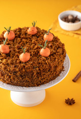 Traditional homemade carrot cake and cream carrots. Copy space.