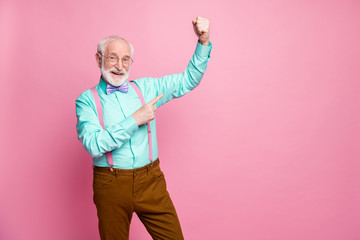 Photo of funny nice grandpa raise fist good mood cool achievement success biceps after gym wear...