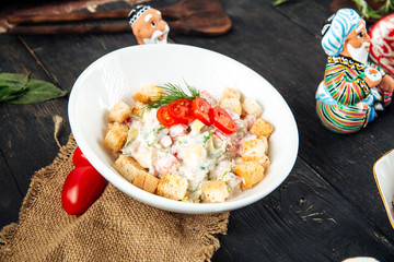 Closeup on malibu salad with mayonnaise crackers 