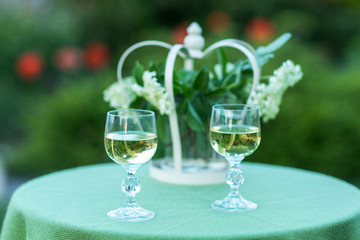 two glasses of tasty white wine at sunset