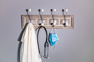 Coat rack of a doctor with a medical mask