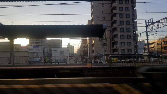 City downtown skyline from subway train window view. Osaka tourist attraction, Japan tourism, Asia transportation or Asian city life concept