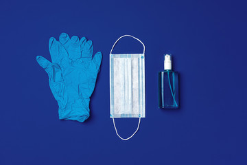 Fototapeta na wymiar Face mask, medical gloves and sanitizer. Coronavirus prevention concept