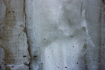 Texture of a concrete wall with cracks and scratches which can be used as a background
