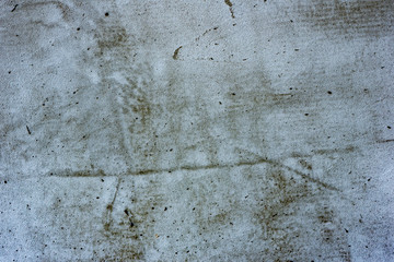 Texture of a concrete wall with cracks and scratches which can be used as a background