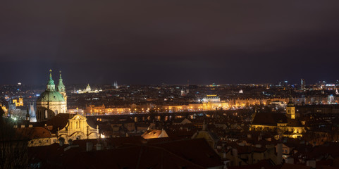 Fototapeta na wymiar Prague skyline at snowless winter night as seen from a vista near the Prague Castle.