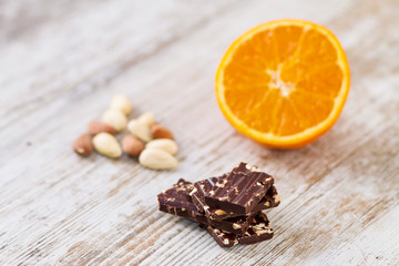 Fototapeta na wymiar Dark chocolate with almonds and fruits