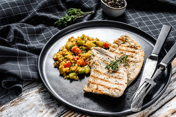 Roast Turkey meat Steaks with quinoa. White background. Top view