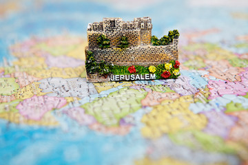 Tourist attractions and souvenir of Jerusalem Israel on world map background of puzzles for travelers. Copy space