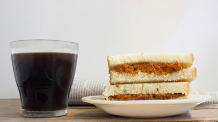 coffee and bread for breakfast with newspaper 